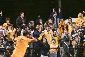 A record-setting crowd packed Dick Dlesk to watch WVU upset Marshall